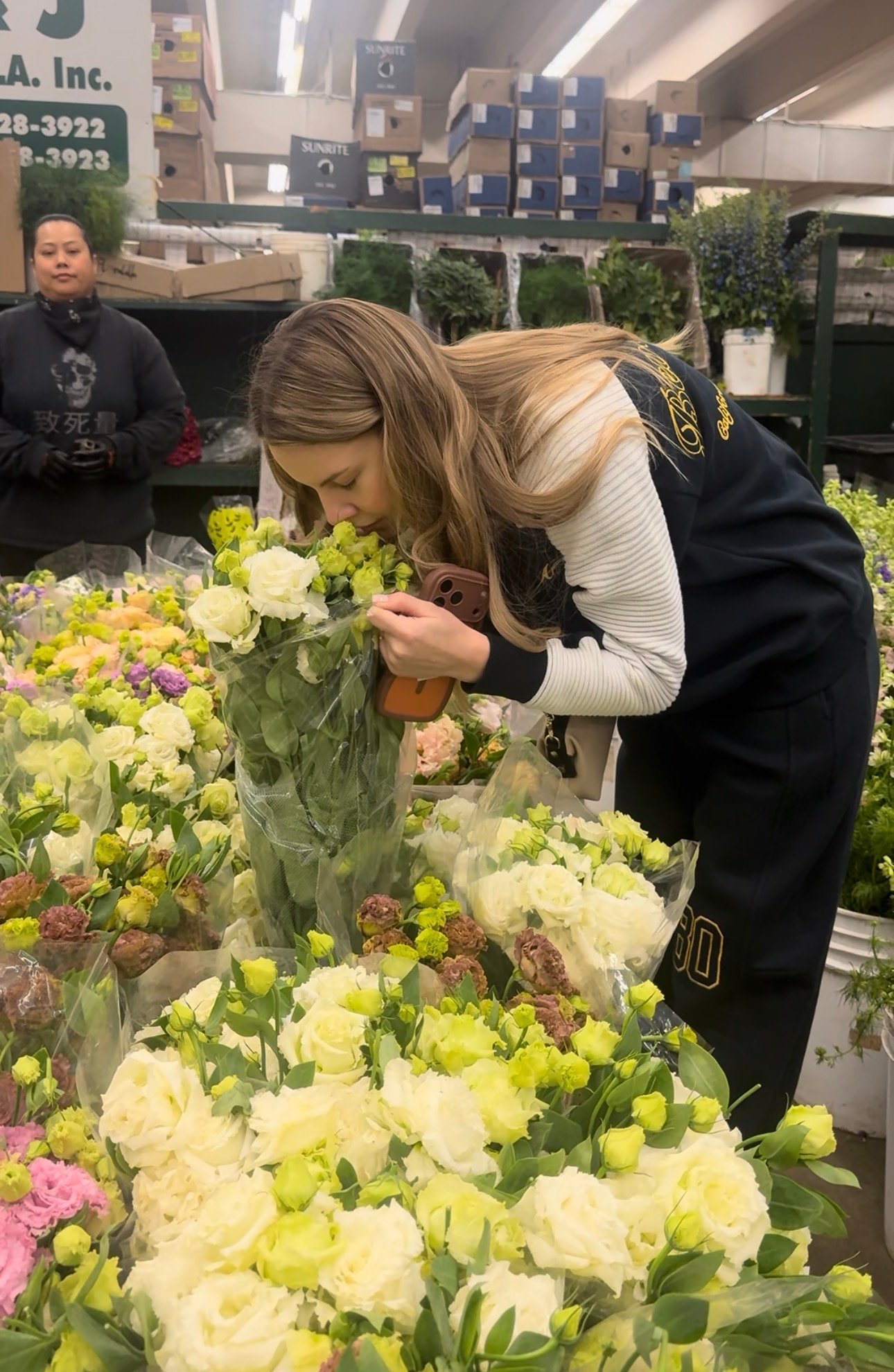 florist choosing fresh flowers at Los Angeles flower market